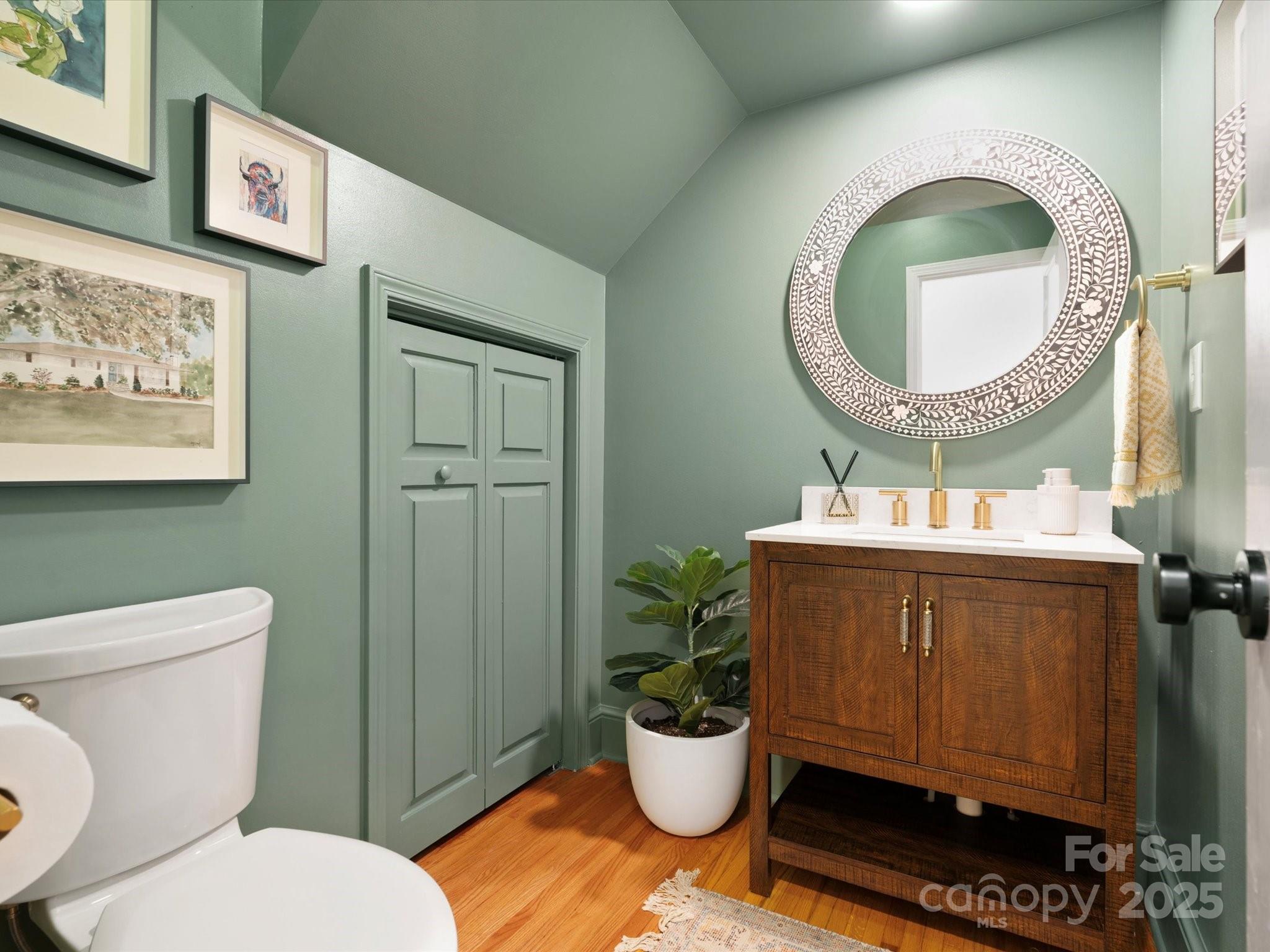 1927 South Wendover Road Charlotte, NC 28211 - Photo 8 of 36 a bathroom with a toilet a sink and a mirror