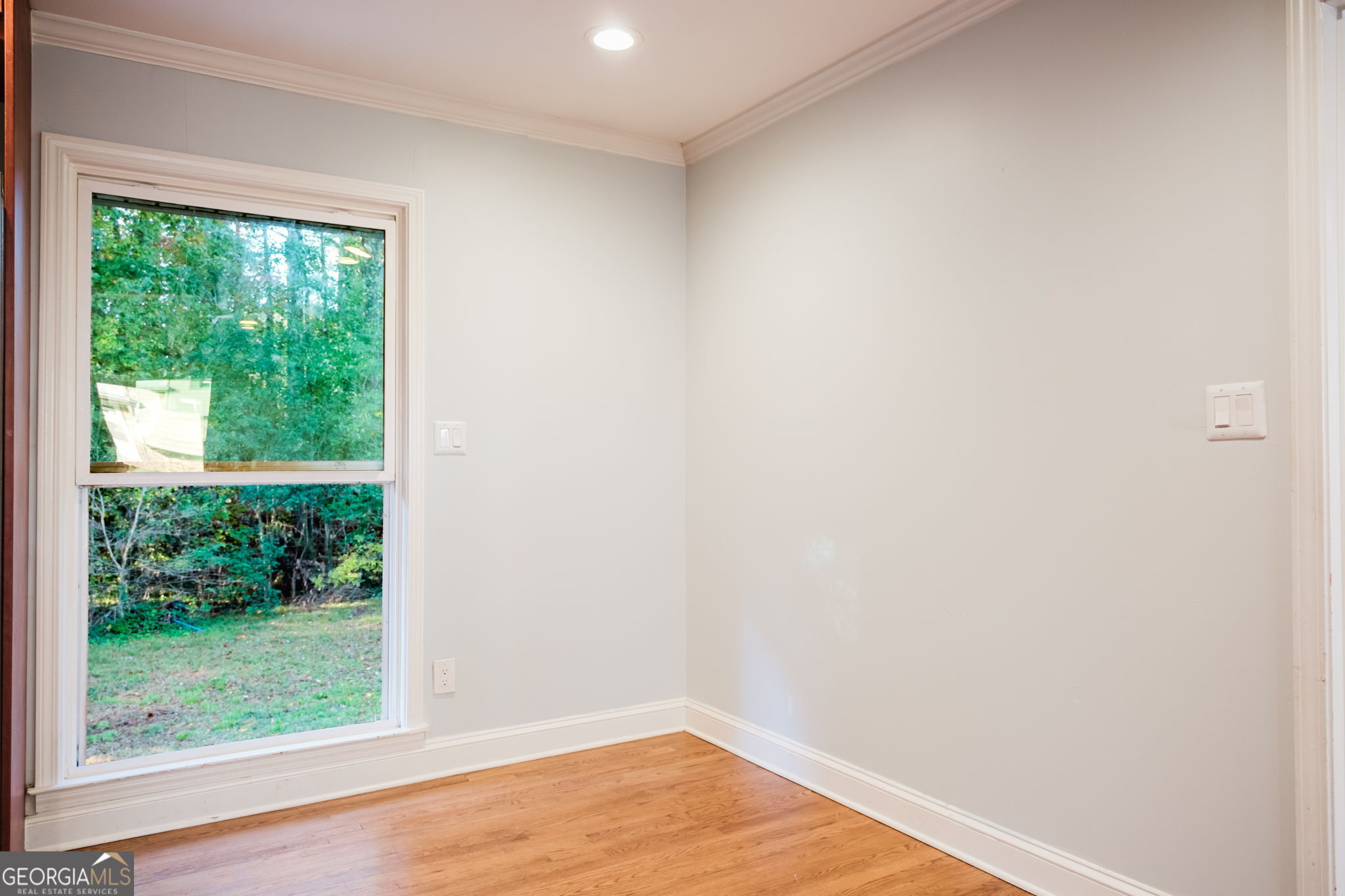 893 Slash Pine Road Forest Park, GA 30297 - Photo 12 of 38 a view of a small space with wooden floor and a window
