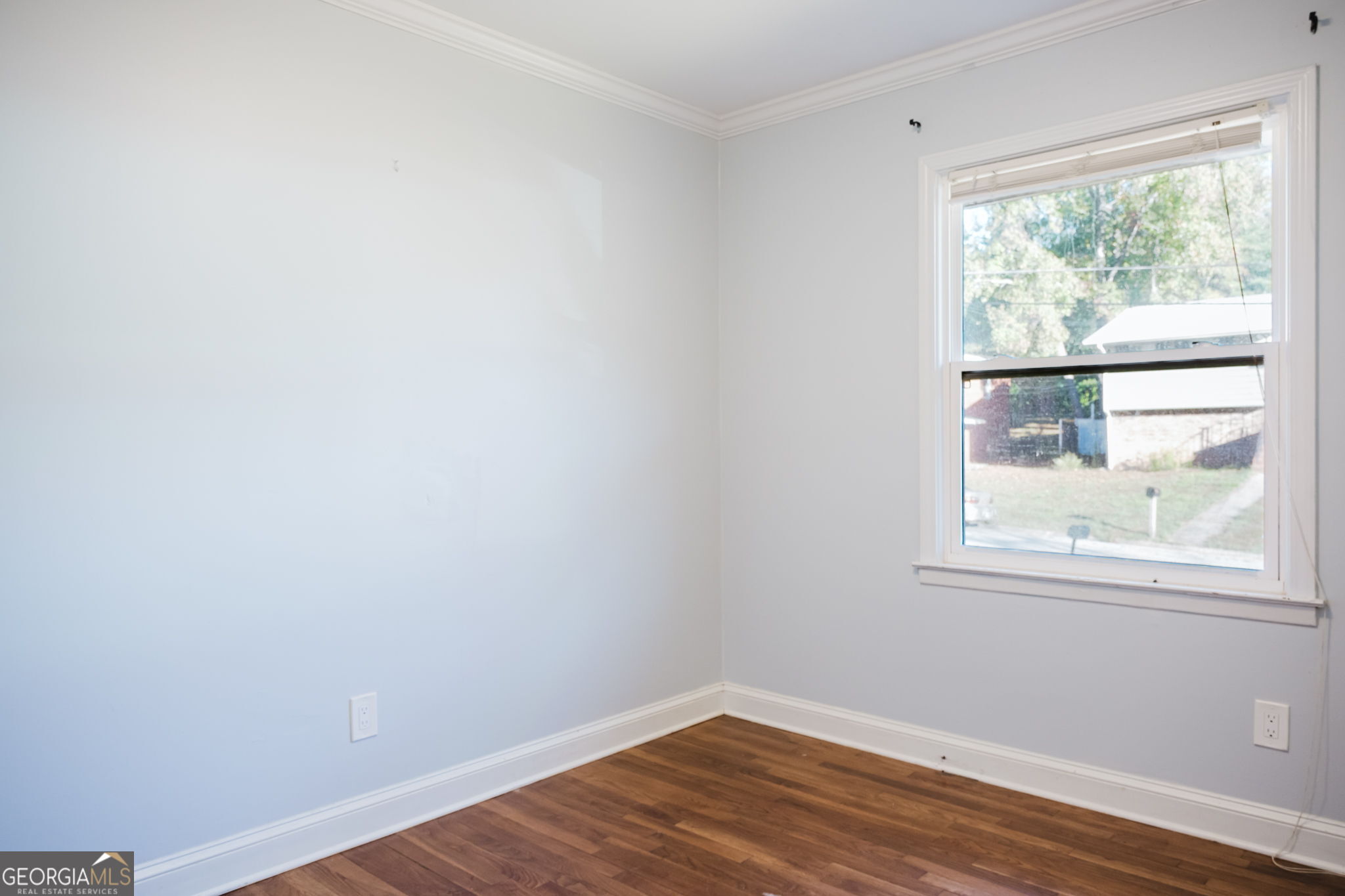 893 Slash Pine Road Forest Park, GA 30297 - Photo 14 of 38 a view of a small space with wooden floor and a window