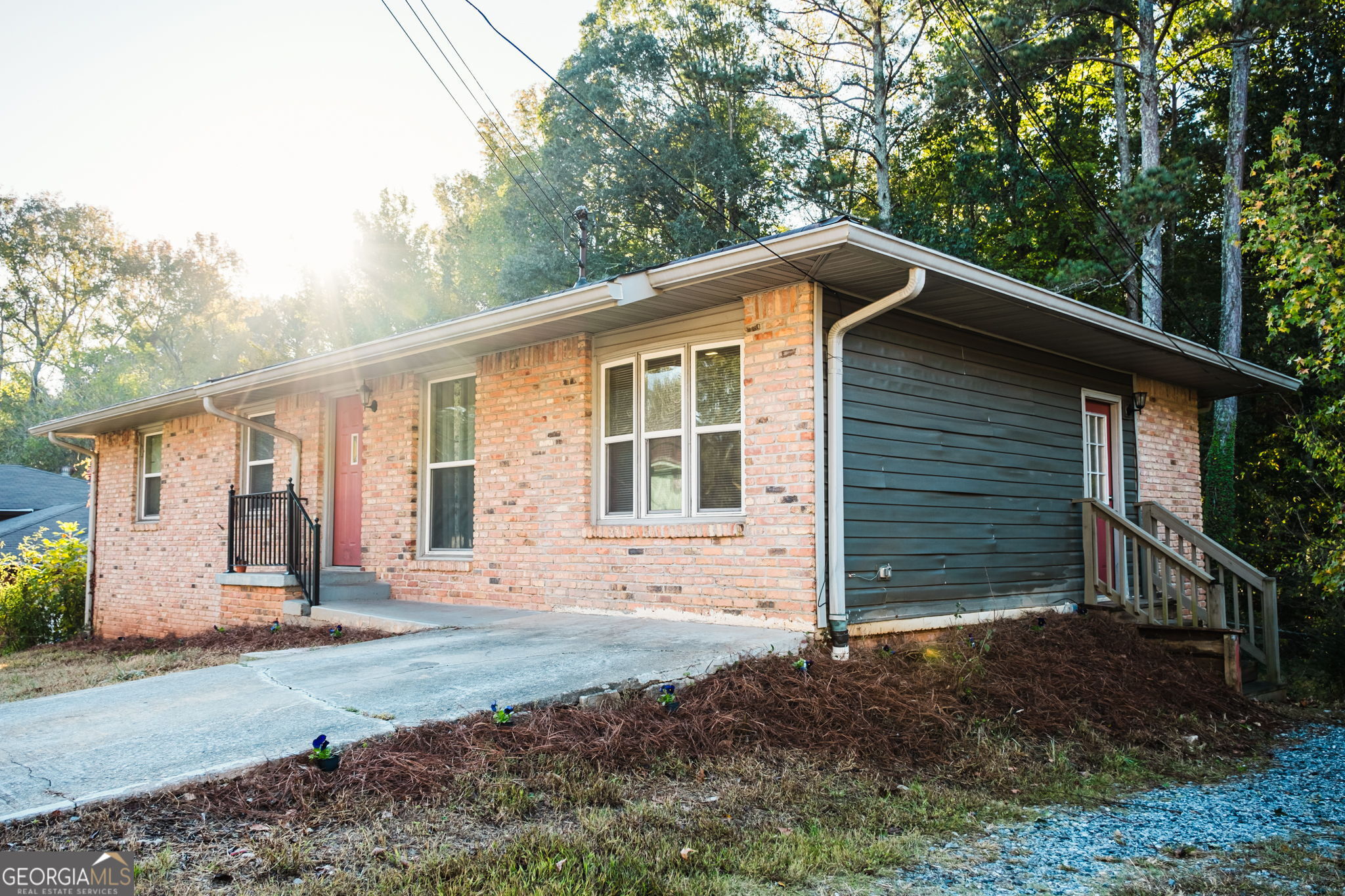 893 Slash Pine Road Forest Park, GA 30297 - Photo 2 of 38 a front view of a house with a yard