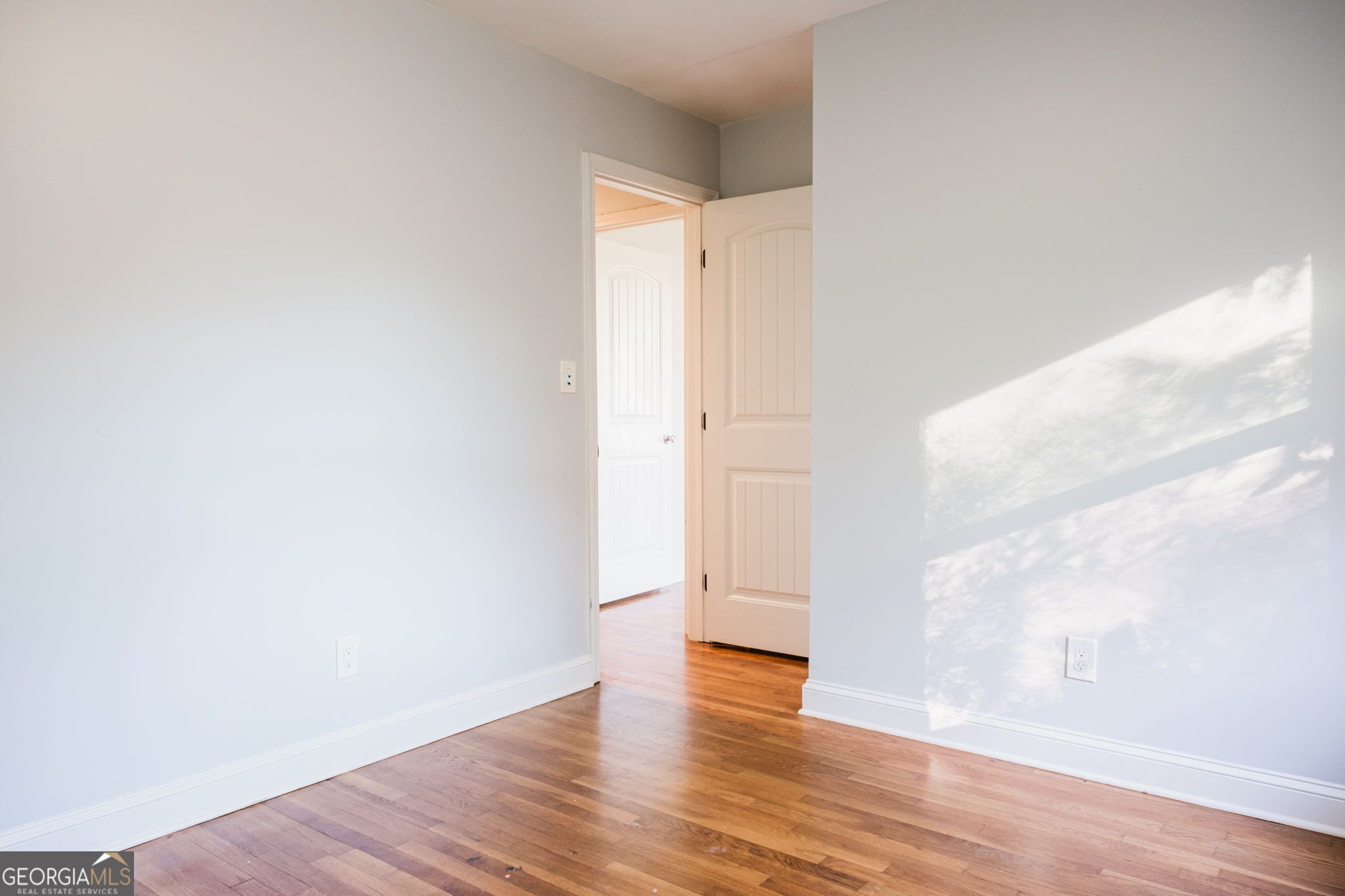 893 Slash Pine Road Forest Park, GA 30297 - Photo 23 of 38 a view of an empty room with wooden floor