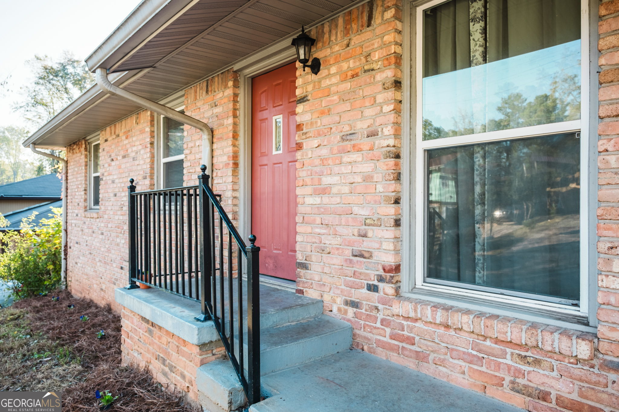 893 Slash Pine Road Forest Park, GA 30297 - Photo 3 of 38 a view of a door with a small yard