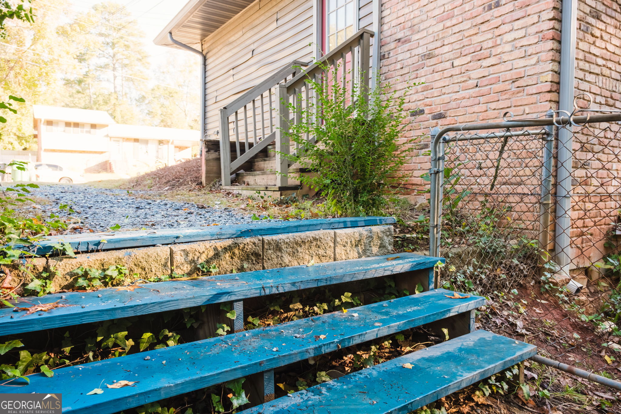 893 Slash Pine Road Forest Park, GA 30297 - Photo 31 of 38 a view of a wooden bench next to a road