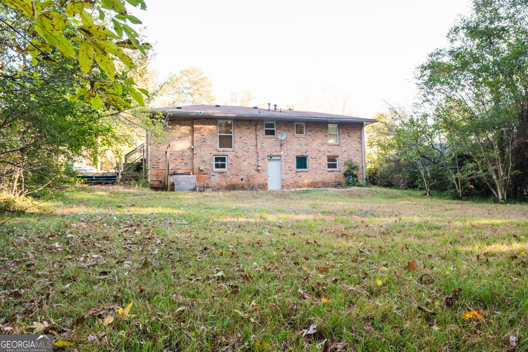 893 Slash Pine Road Forest Park, GA 30297 - Photo 33 of 38 a front view of a house with garden