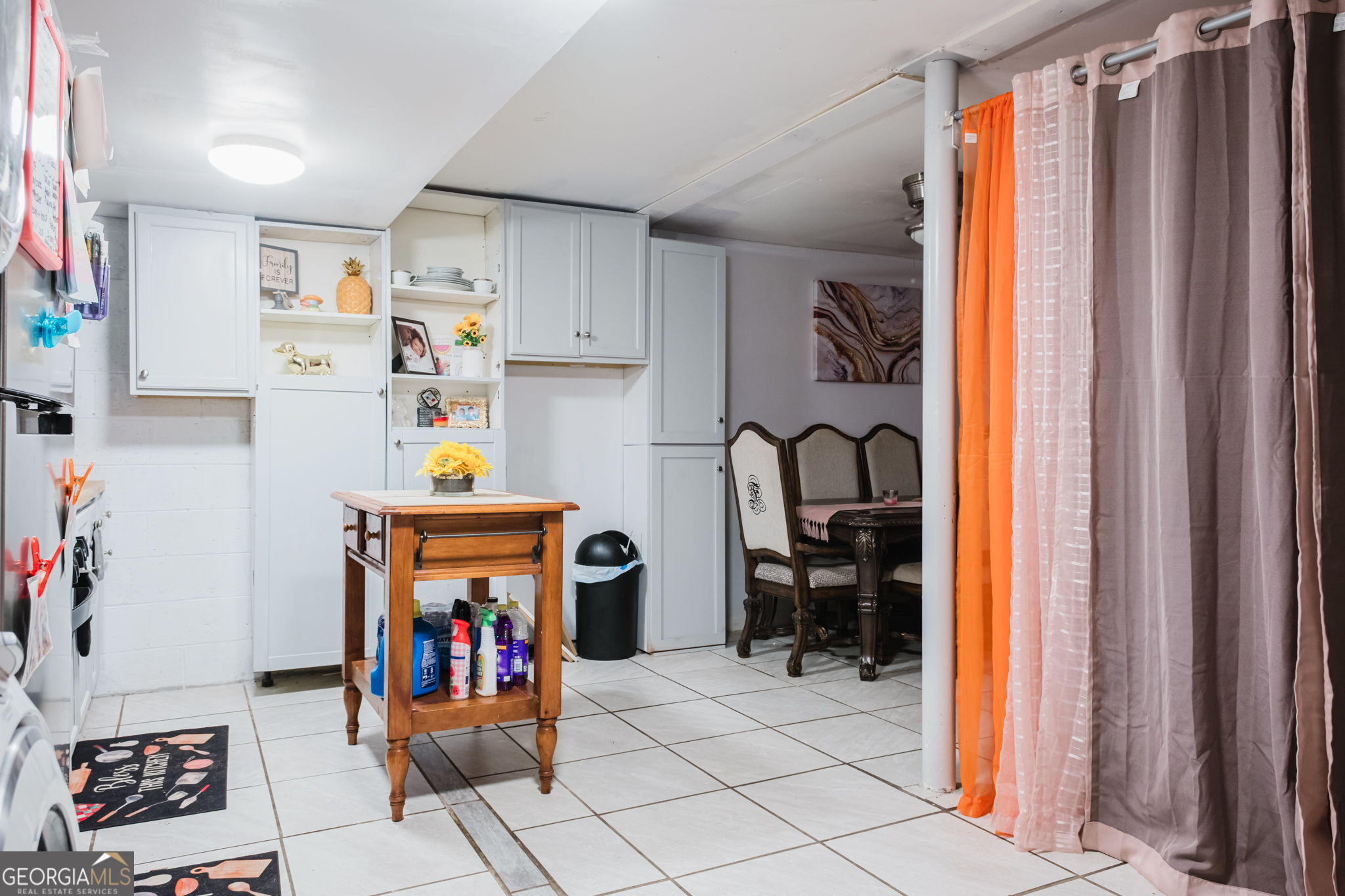 893 Slash Pine Road Forest Park, GA 30297 - Photo 34 of 38 a view of storage and utility room with fridge and workspace