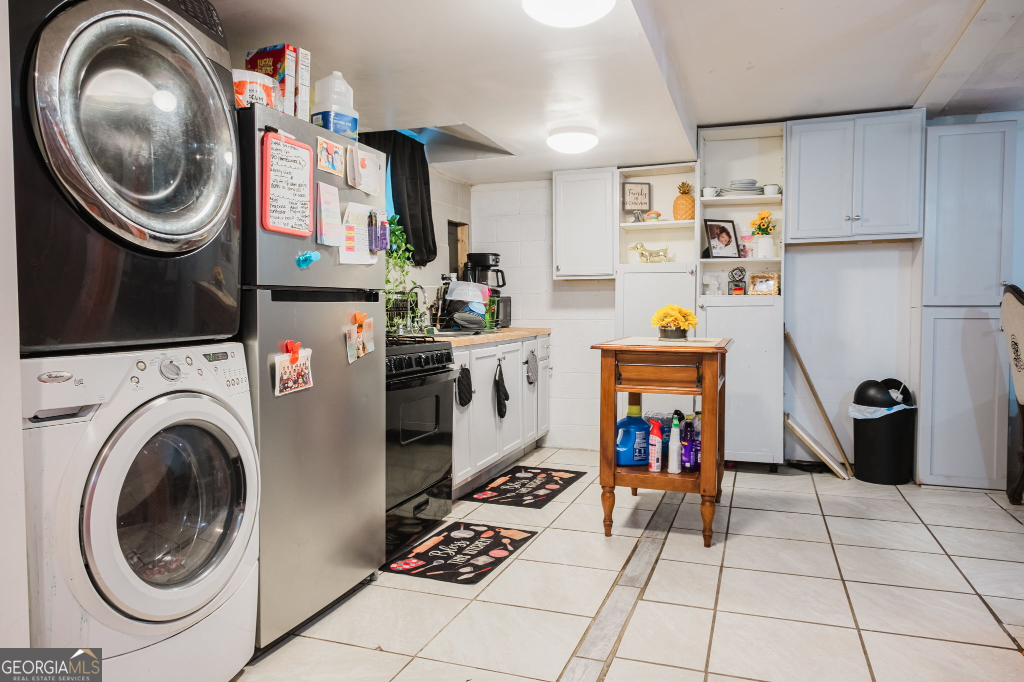 893 Slash Pine Road Forest Park, GA 30297 - Photo 37 of 38 a utility room with cabinets dryer and washer