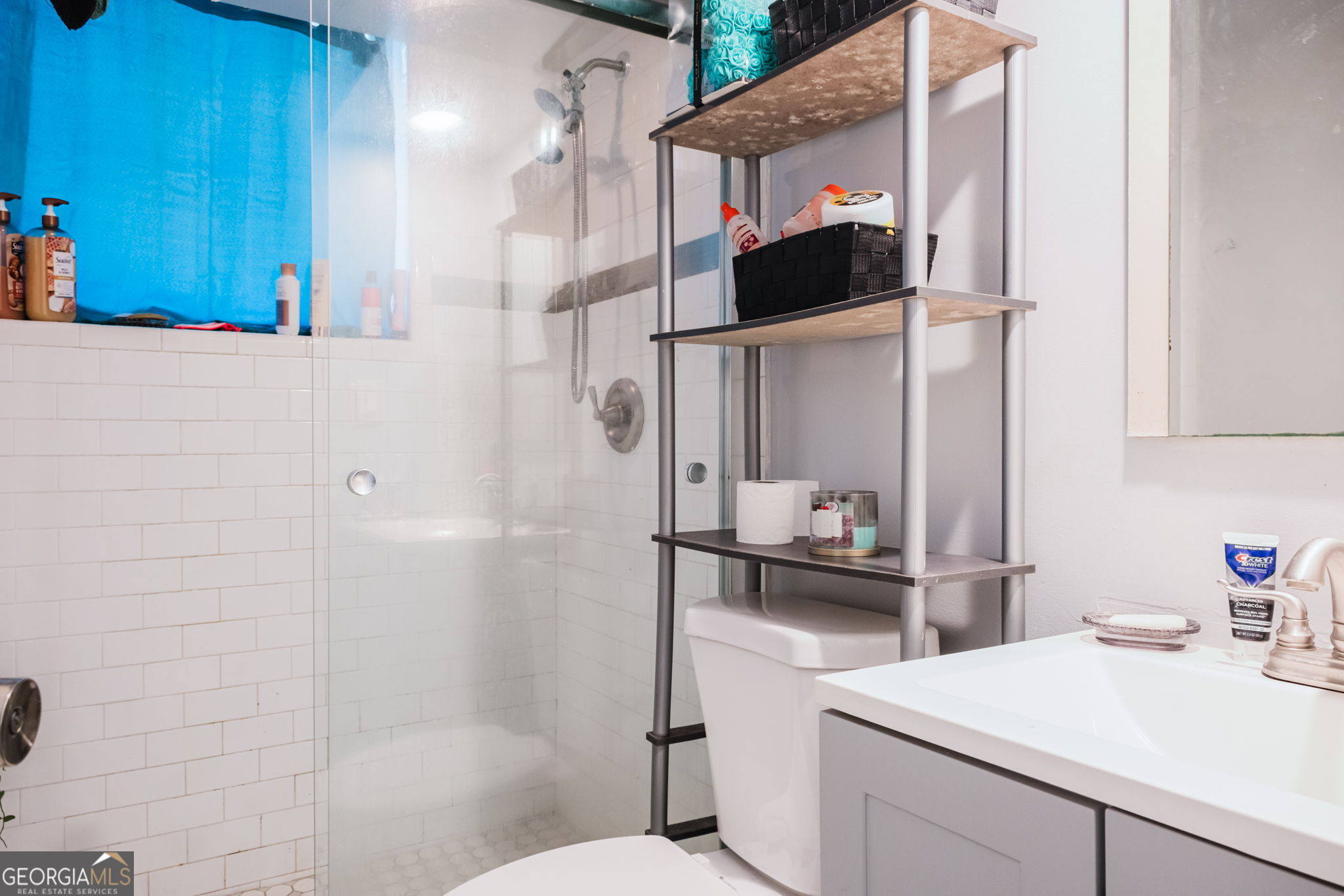 893 Slash Pine Road Forest Park, GA 30297 - Photo 38 of 38 a bathroom with a sink and a mirror
