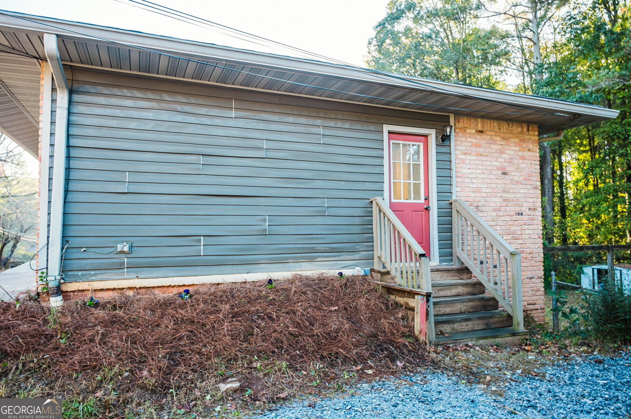 893 Slash Pine Road Forest Park, GA 30297 - Photo 4 of 38 a view of a house with a small yard