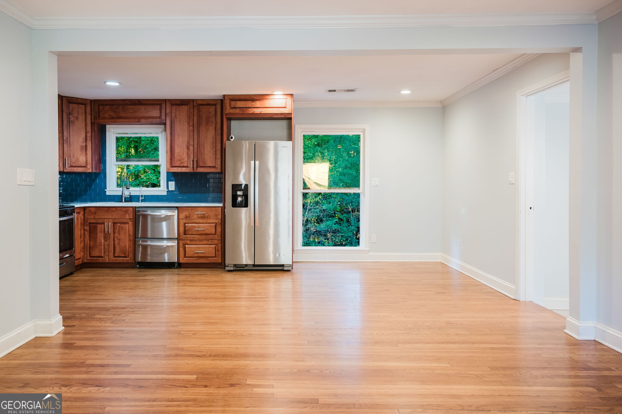893 Slash Pine Road Forest Park, GA 30297 - Photo 9 of 38 a view of a kitchen with a sink and a large window