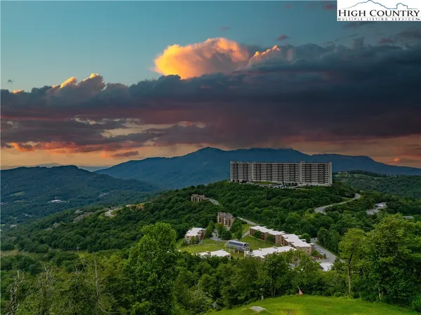 a view of a houses with a yard