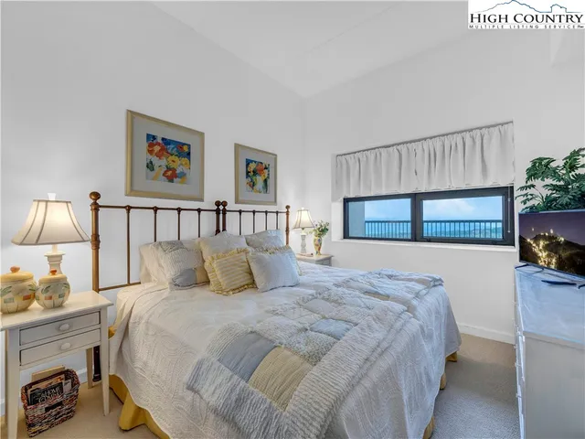 a bathroom with a granite countertop sink toilet a mirror a vanity and shower
