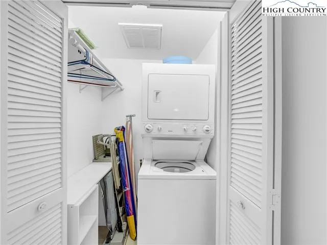 a view of a balcony with furniture