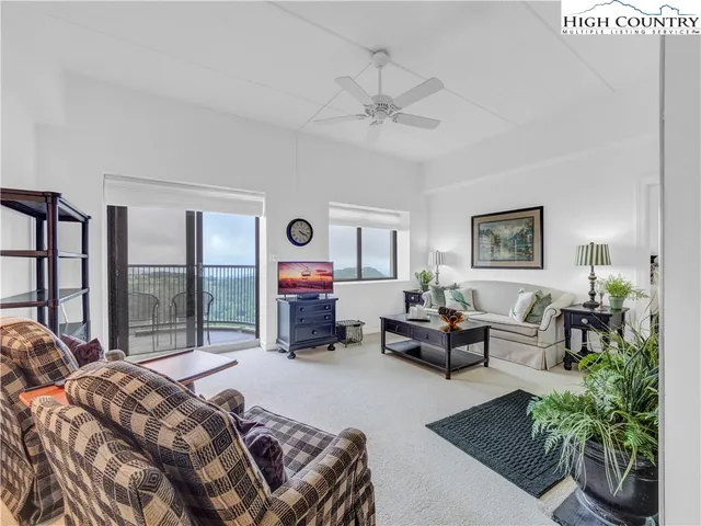 a bedroom with a bed a couch and dresser