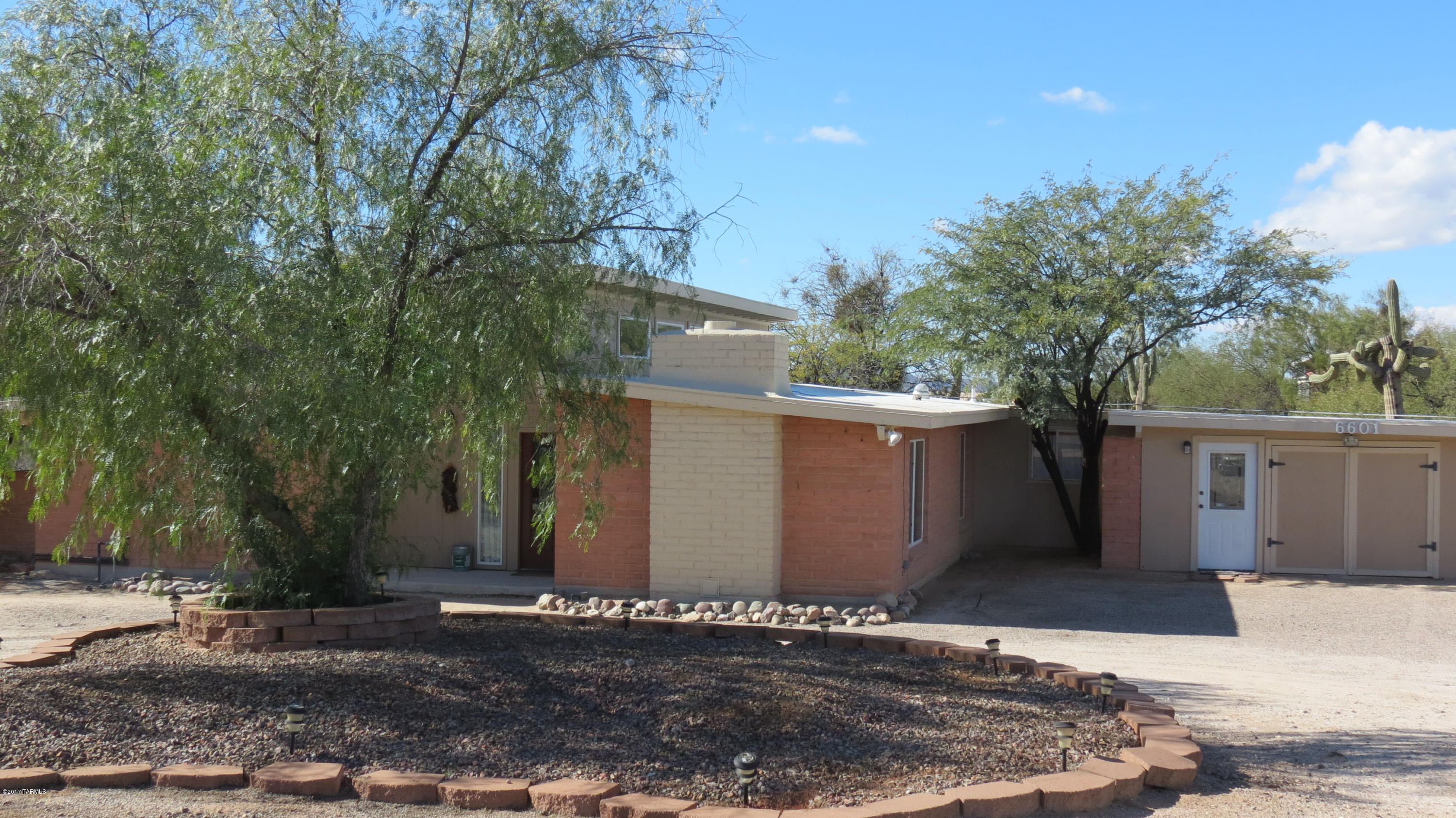 6601 North Mona Lisa Road Tucson, AZ 85741 - Photo 23 of 23 a view of a house with a yard