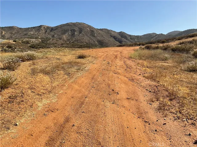 a view of mountain with sunset