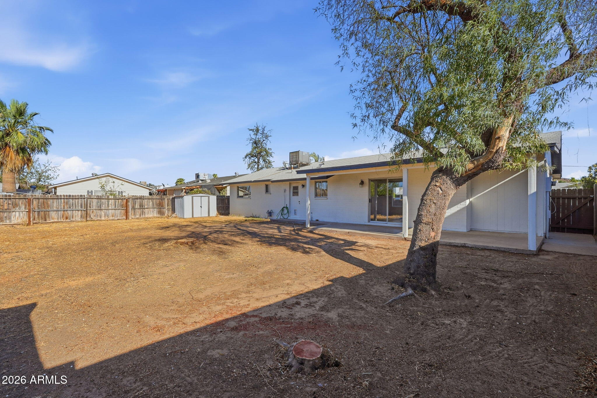 2302 East Nisbet Road Phoenix, AZ 85022 - Photo 21 of 22 a view of a house with a yard and garage
