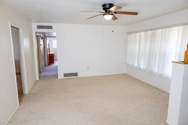 a view of an empty room with a window