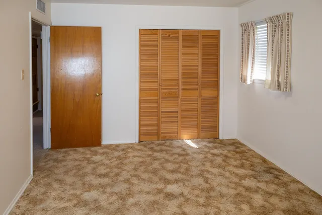 a view of an empty room and window