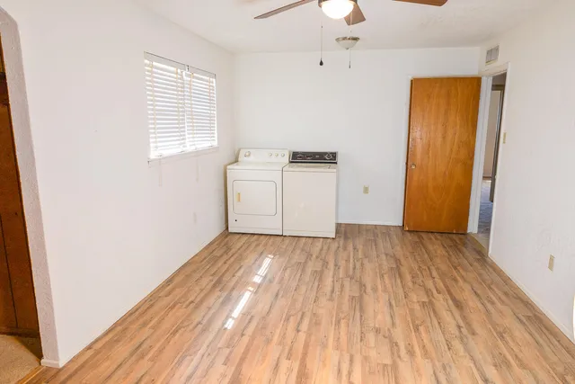 a view of an empty room and a window
