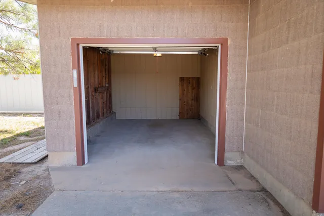 a view of a patio with table and chairs a barbeque with wooden fence