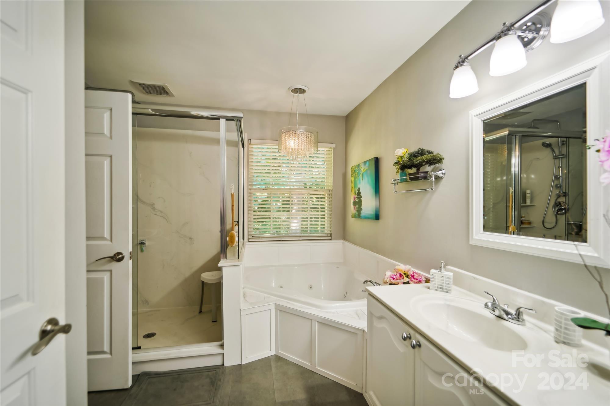 504 Haley Court Fort Mill, SC 29708 - Photo 18 of 31 a bathroom with a granite countertop sink a mirror and a bathtub