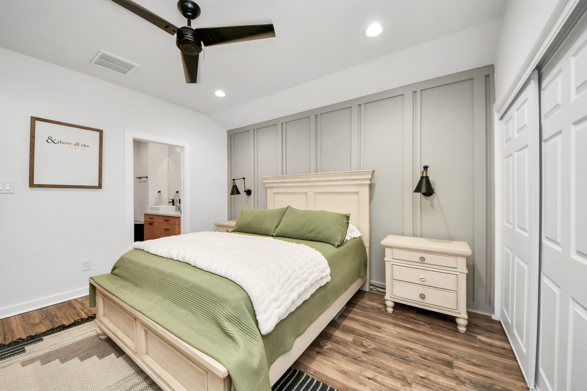 111 Jenkins Street Houston, TX 77003 - Photo 11 of 24 a bedroom with a bed and a mirror