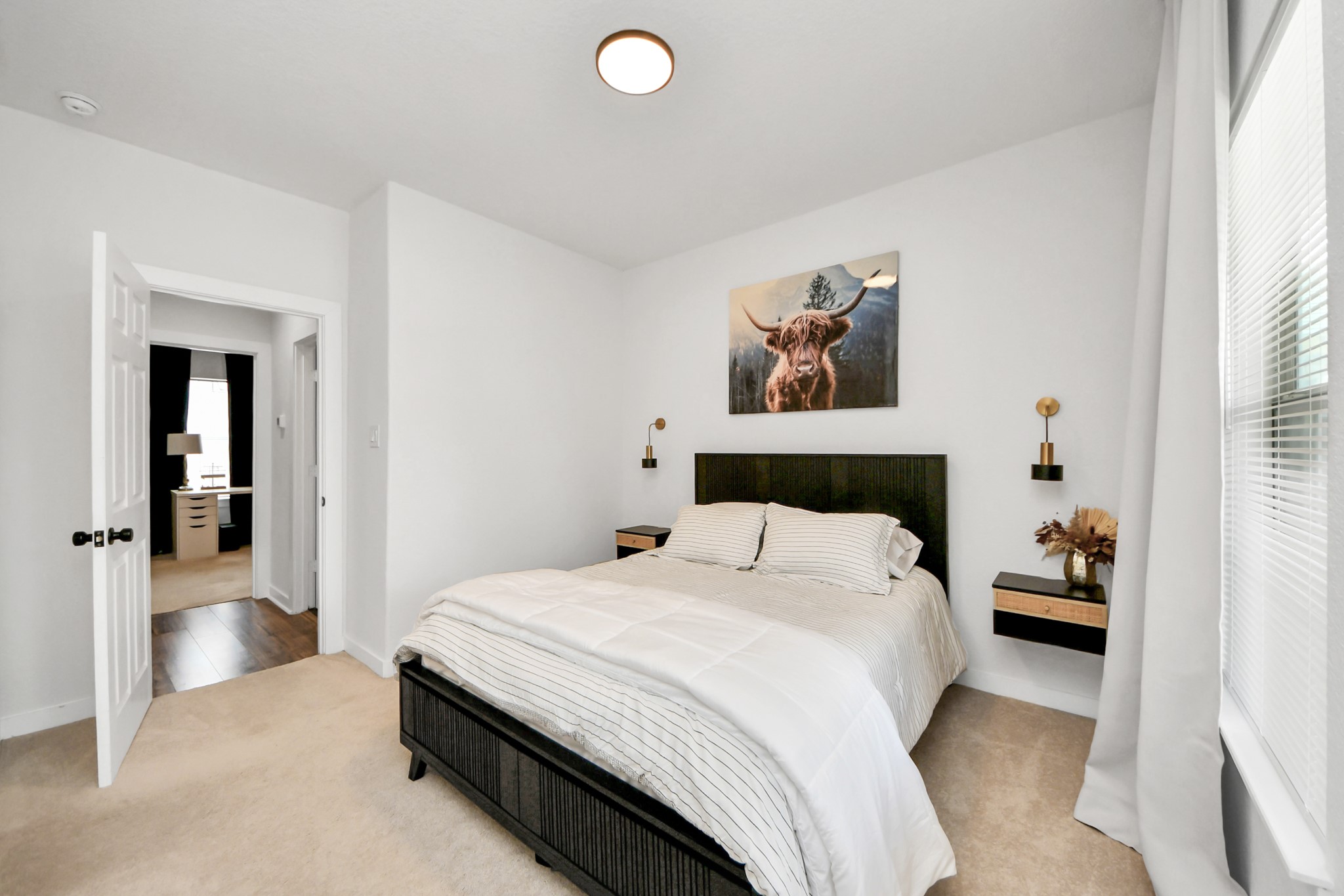 111 Jenkins Street Houston, TX 77003 - Photo 16 of 24 a bedroom with a bed and a painting on the wall