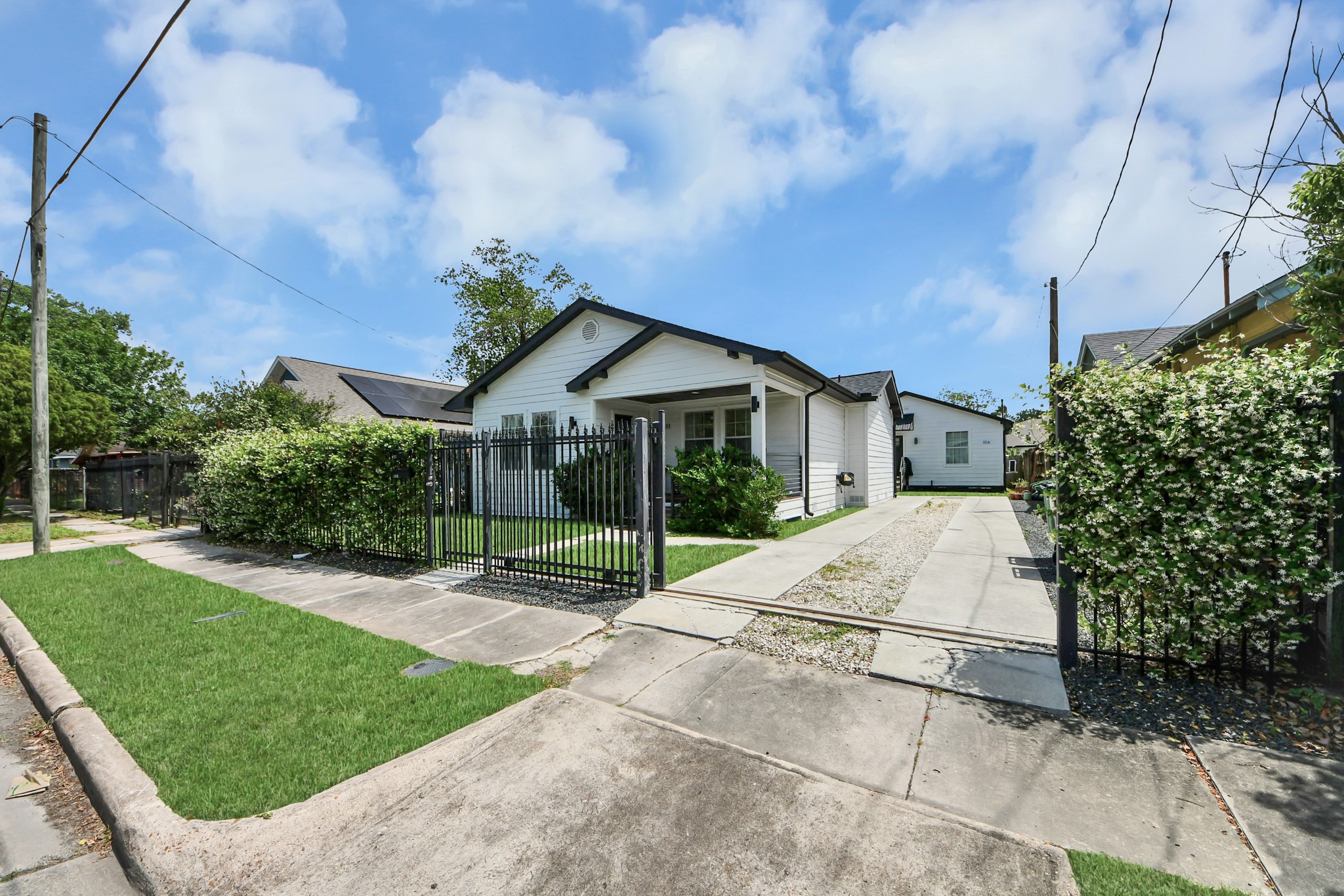 111 Jenkins Street Houston, TX 77003 - Photo 22 of 24 a view of a house with a yard and potted plants