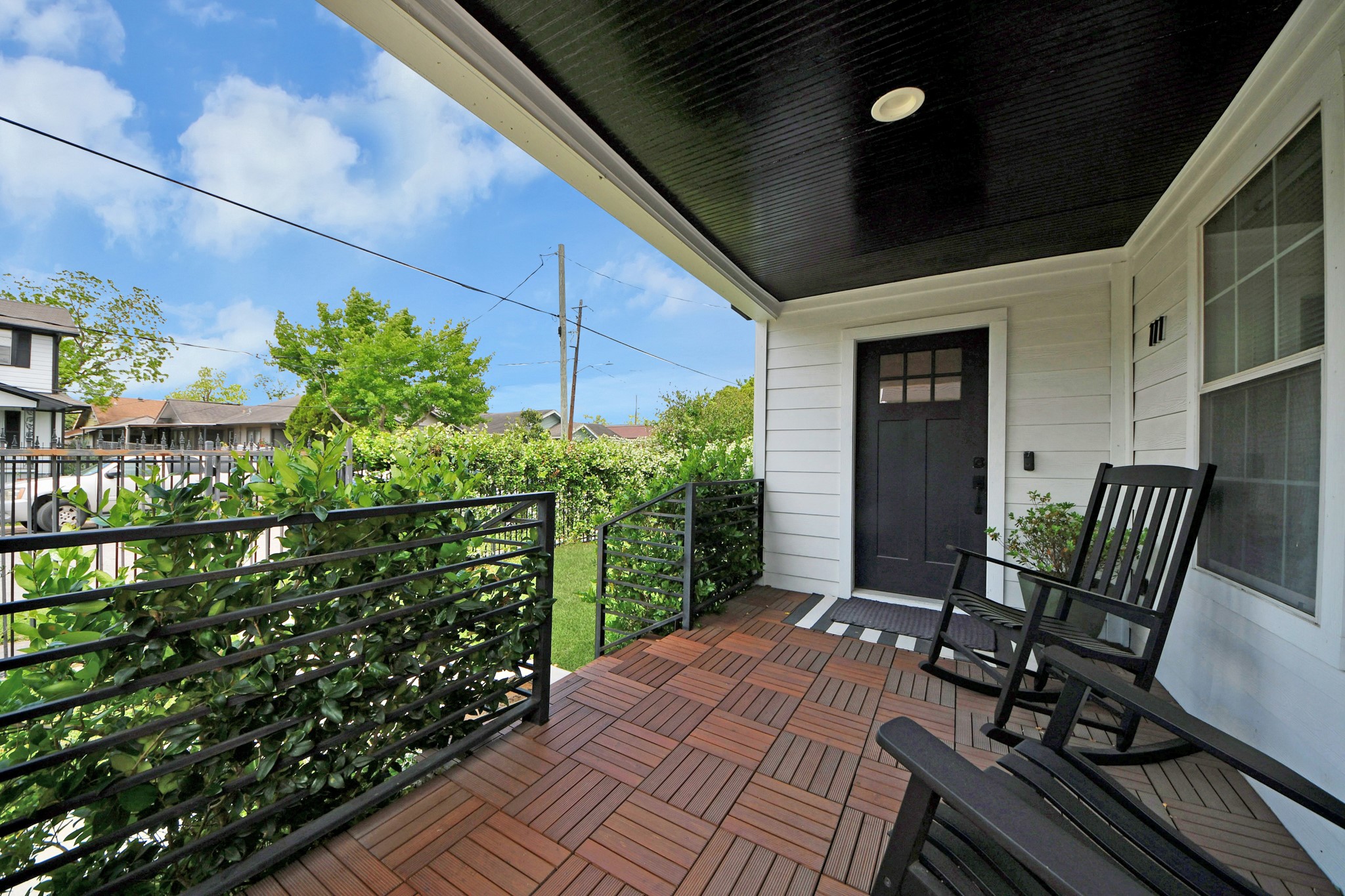 111 Jenkins Street Houston, TX 77003 - Photo 3 of 24 a balcony with chairs and potted plants