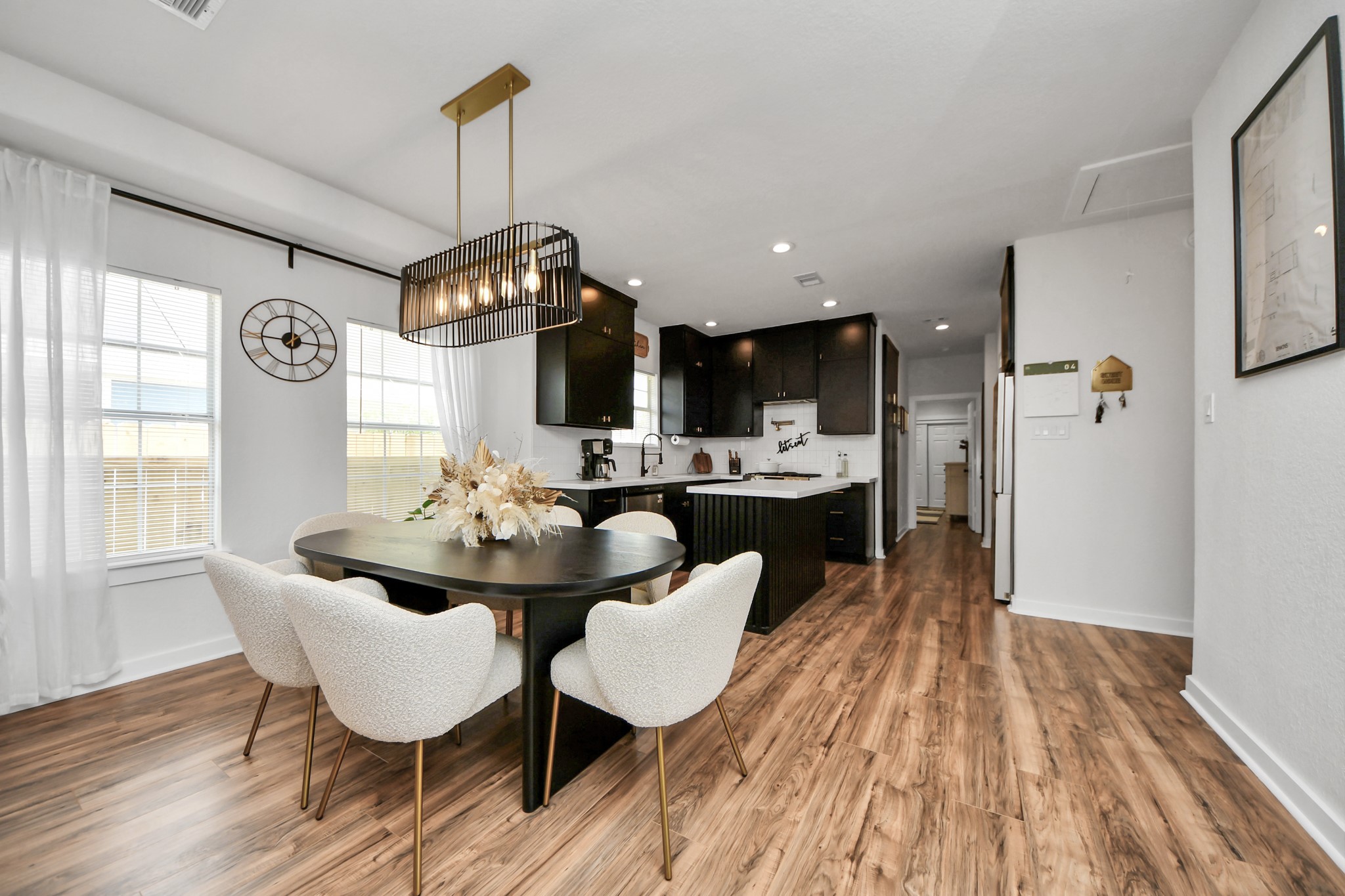 111 Jenkins Street Houston, TX 77003 - Photo 6 of 24 a dining room with furniture a rug and wooden floor