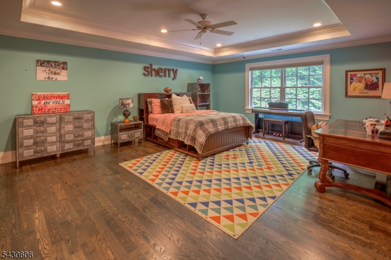 5 Burnett Road Mendham, NJ 07945 - Photo 31 of 50 a bedroom with a bed and wooden floor