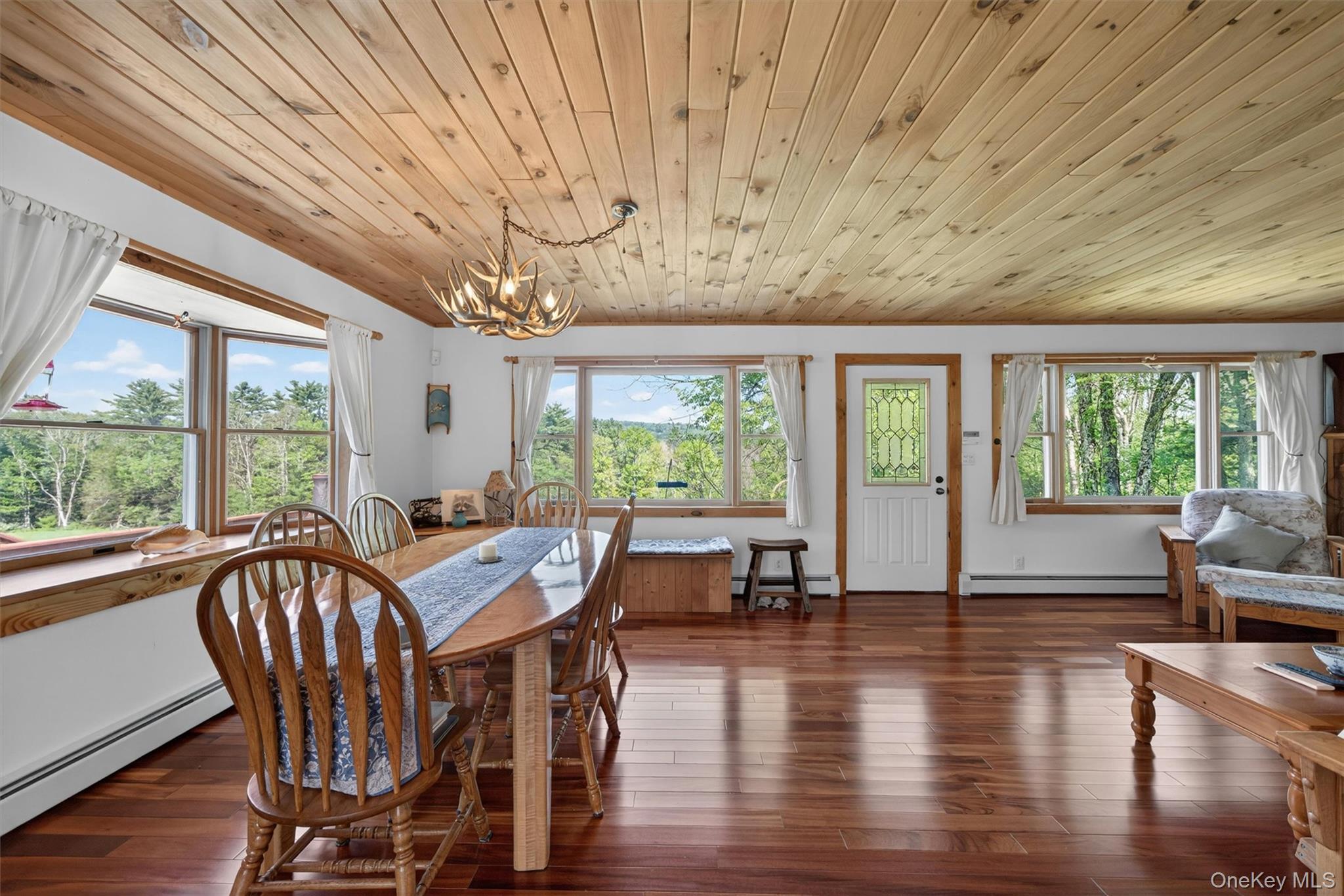 340 Hospital Road Callicoon, NY 12723 - Photo 11 of 41 a view of a dining room with furniture window and wooden floor