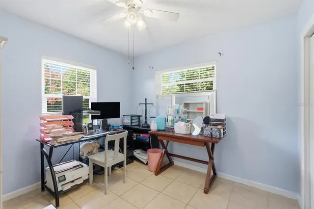 a work room with furniture and a window