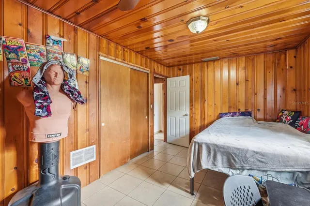 a bedroom with a bed and a table