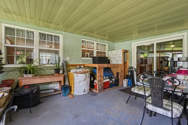 a view of a room with furniture and windows