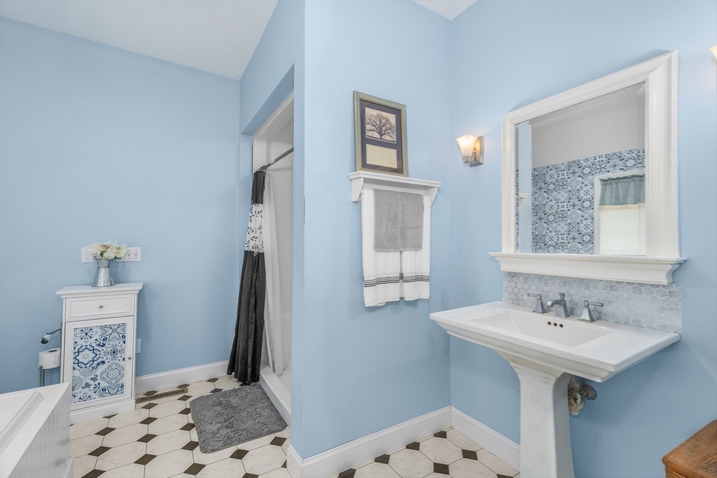 113 Greenwich Plains Road Ware, MA 01082 - Photo 19 of 42 a bathroom with a sink a mirror and a toilet