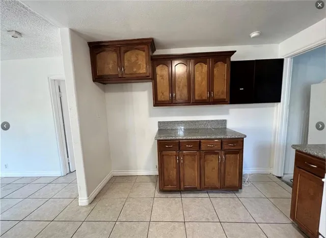a view of a refrigerator and window in a hall