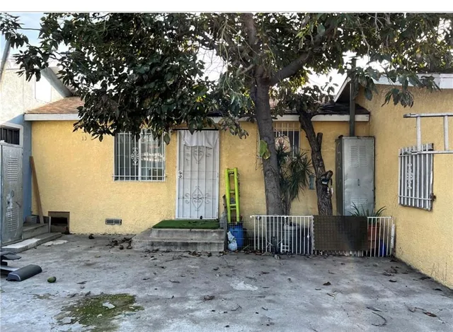 a view of a backyard with a sitting area