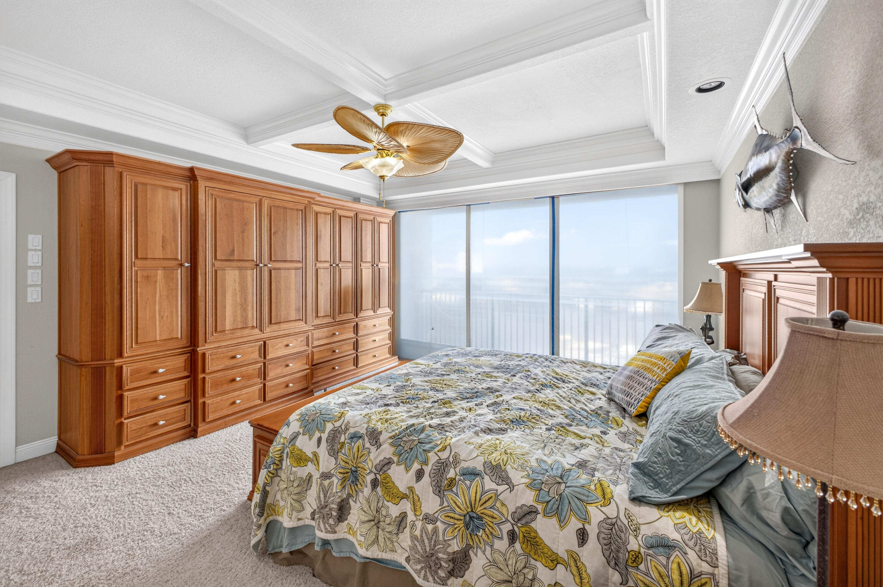 30 Moreno Point Road, Unit 703A Destin, FL 32541 - Photo 33 of 60 a bedroom with a bed and a chandelier