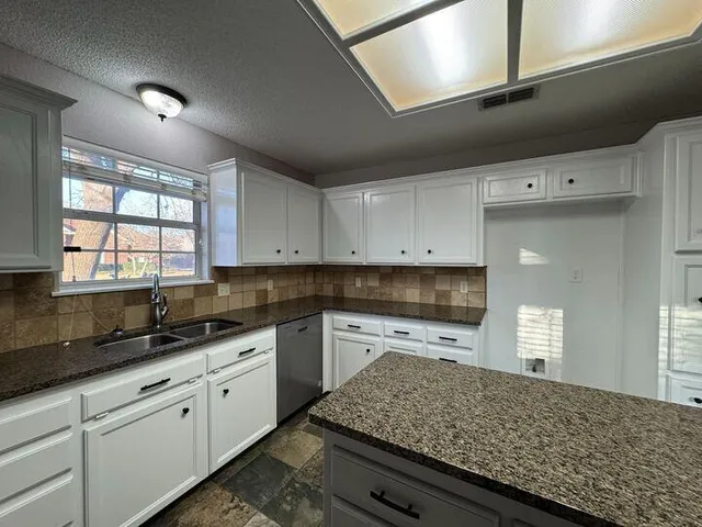 a view of a backyard of a house