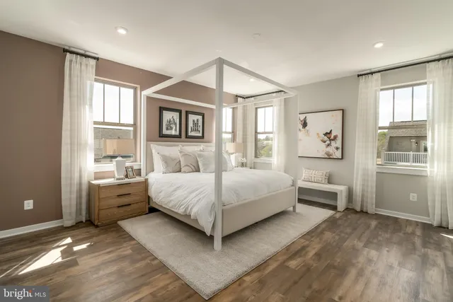 a bedroom with a large bed and a window