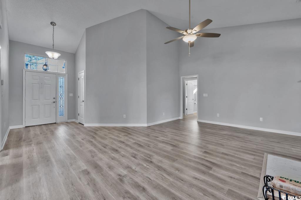 1639 Coventry Road Surfside Beach, SC 29575 - Photo 35 of 38 Foyer entrance featuring a high ceiling, ceiling fan, and light hardwood / wood-style flooring