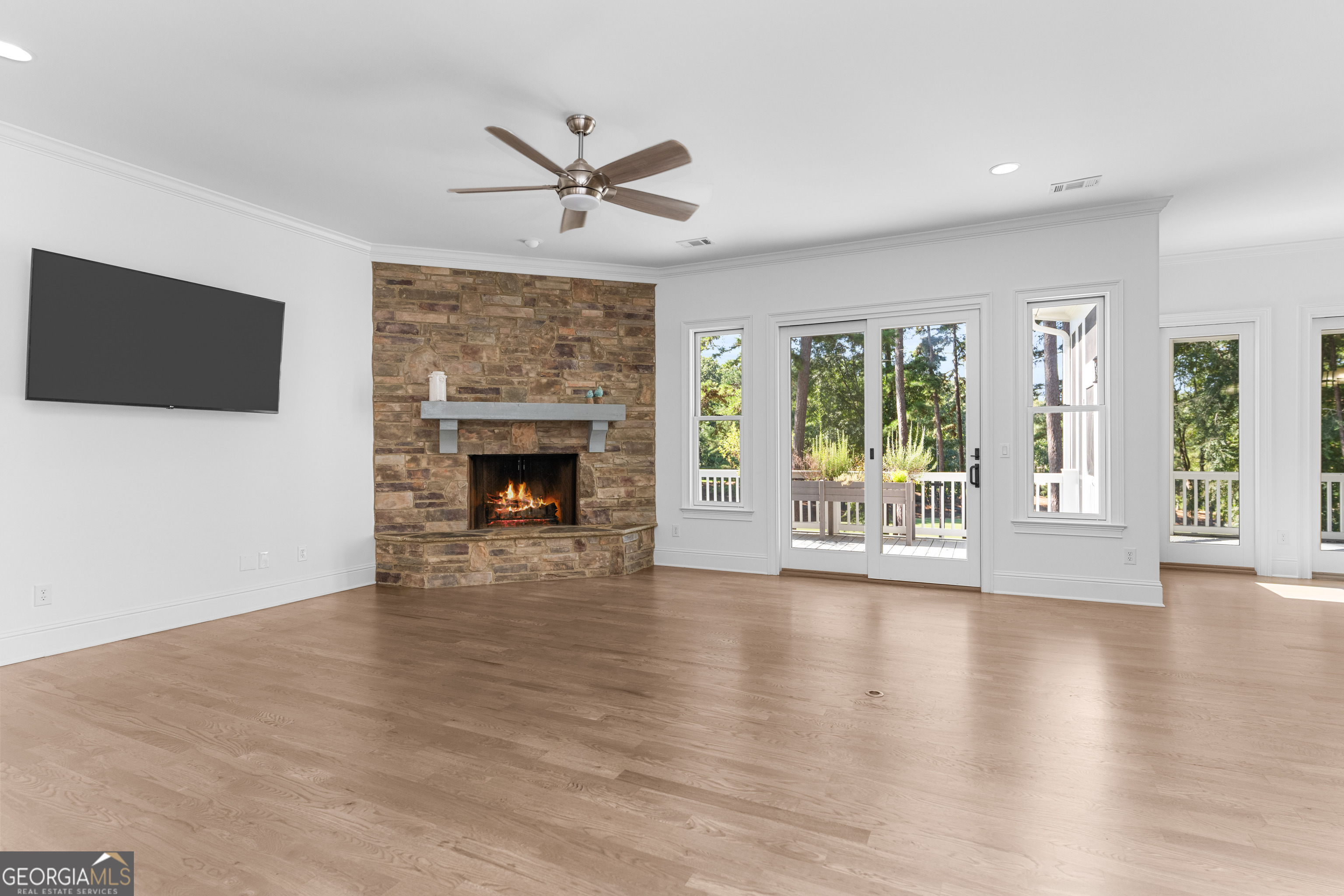 1011 Ridge Terrace Greensboro, GA 30642 - Photo 16 of 72 a view of an empty room with a fireplace and a window
