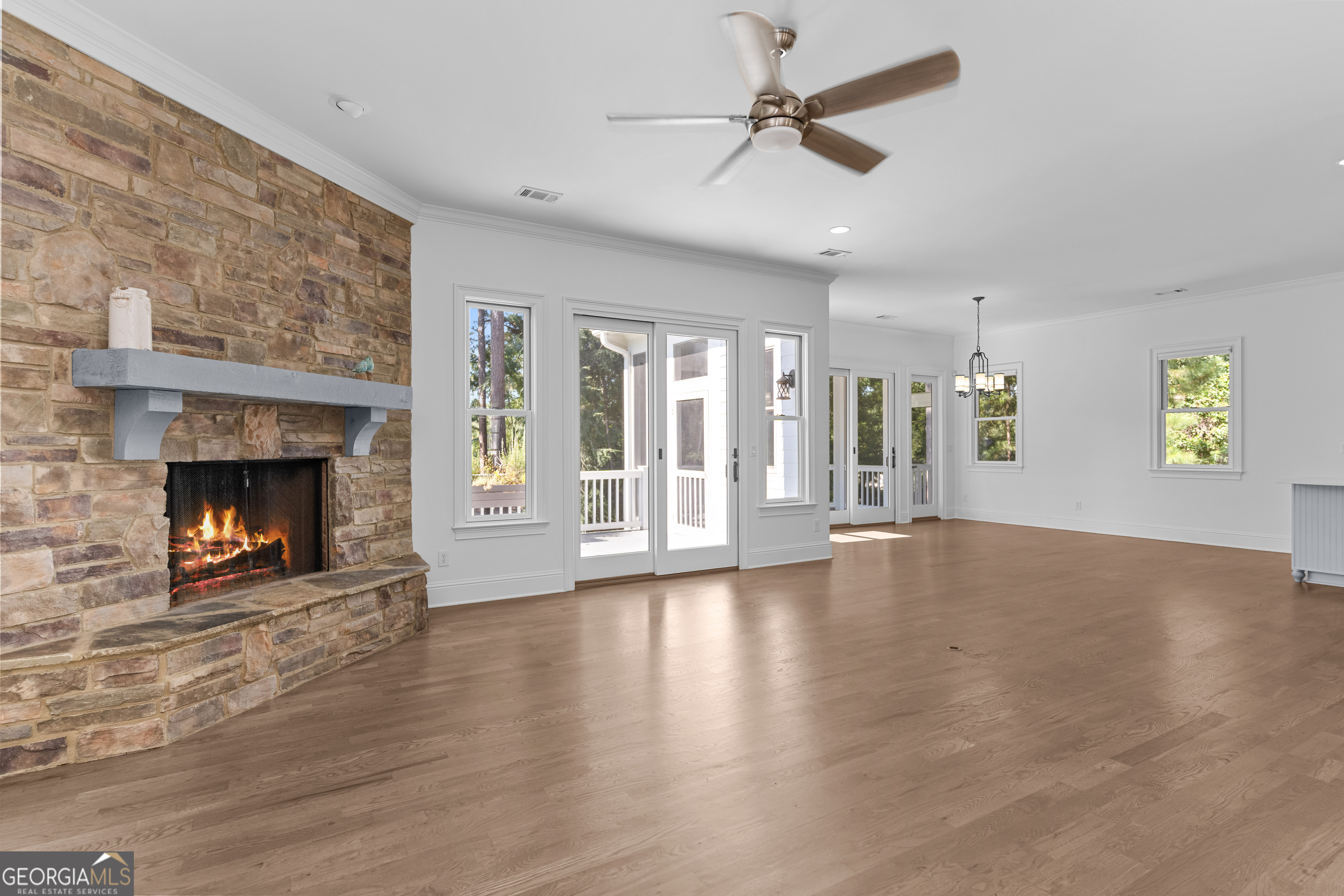 1011 Ridge Terrace Greensboro, GA 30642 - Photo 18 of 72 a view of an empty room with a fireplace and a window