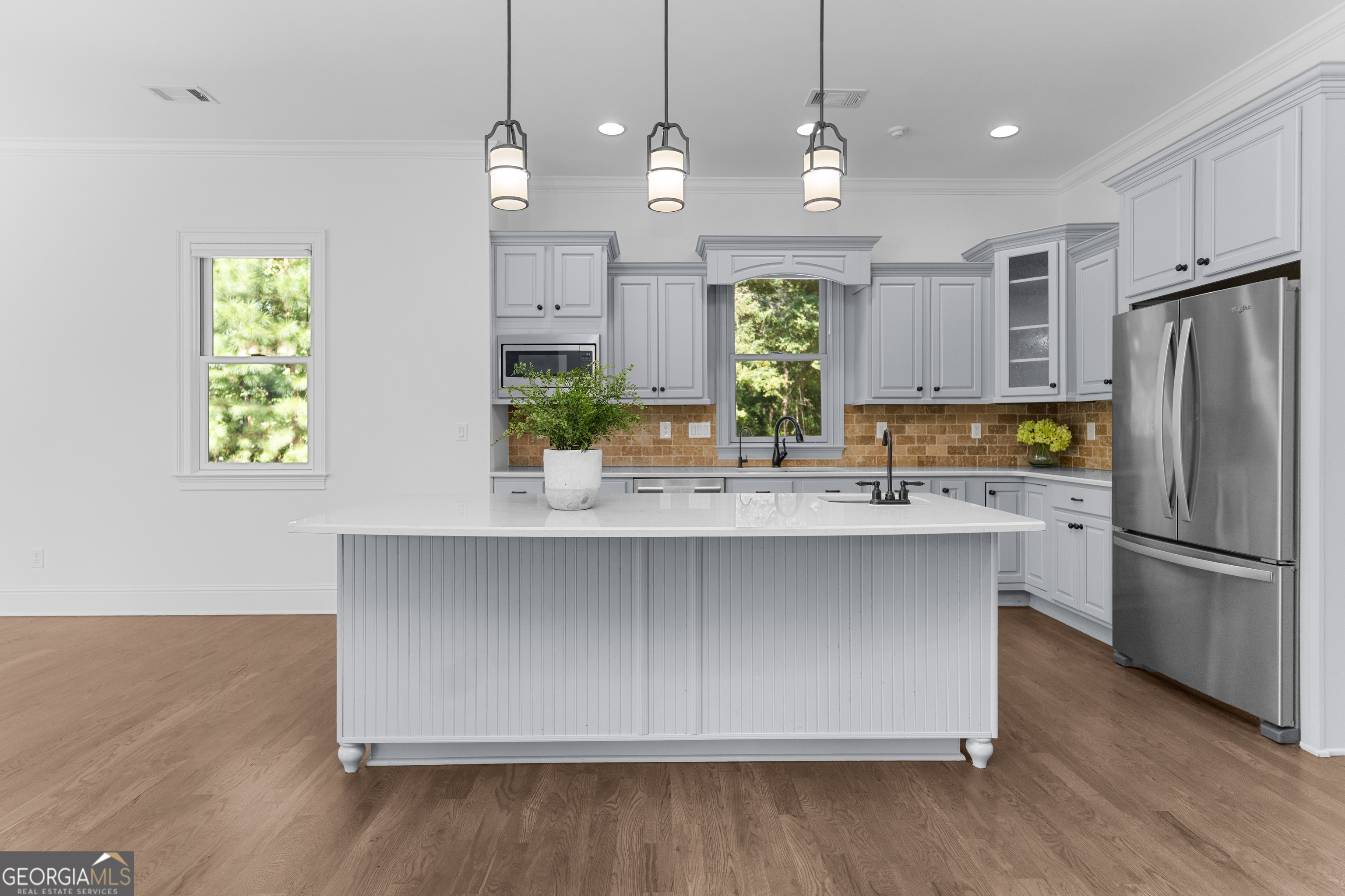 1011 Ridge Terrace Greensboro, GA 30642 - Photo 22 of 72 a kitchen with stainless steel appliances granite countertop a refrigerator a sink a stove and a wooden floors