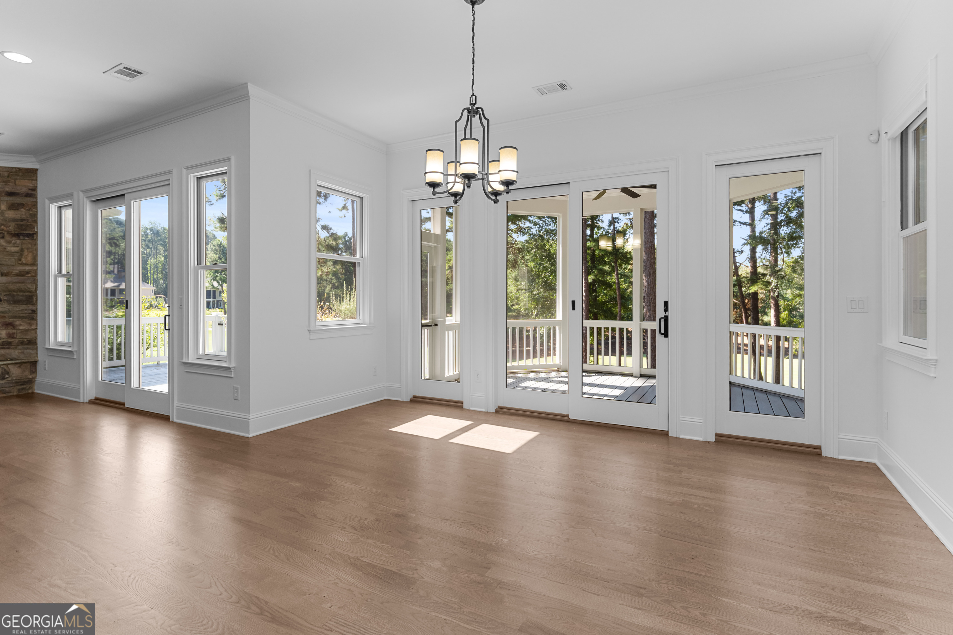 1011 Ridge Terrace Greensboro, GA 30642 - Photo 25 of 72 a view of an empty room with wooden floor and a window