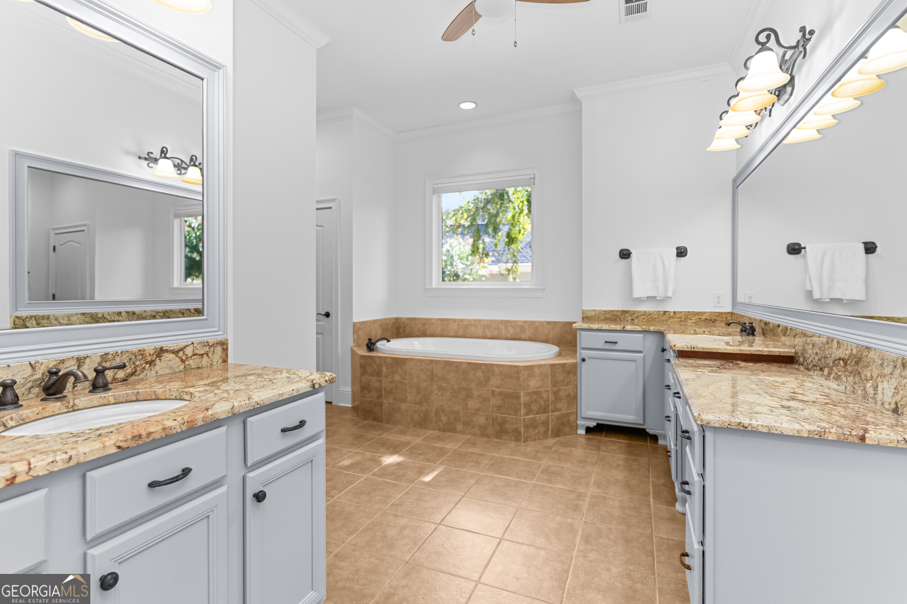 1011 Ridge Terrace Greensboro, GA 30642 - Photo 35 of 72 a bathroom with a granite countertop bathtub sink vanity mirror and toilet