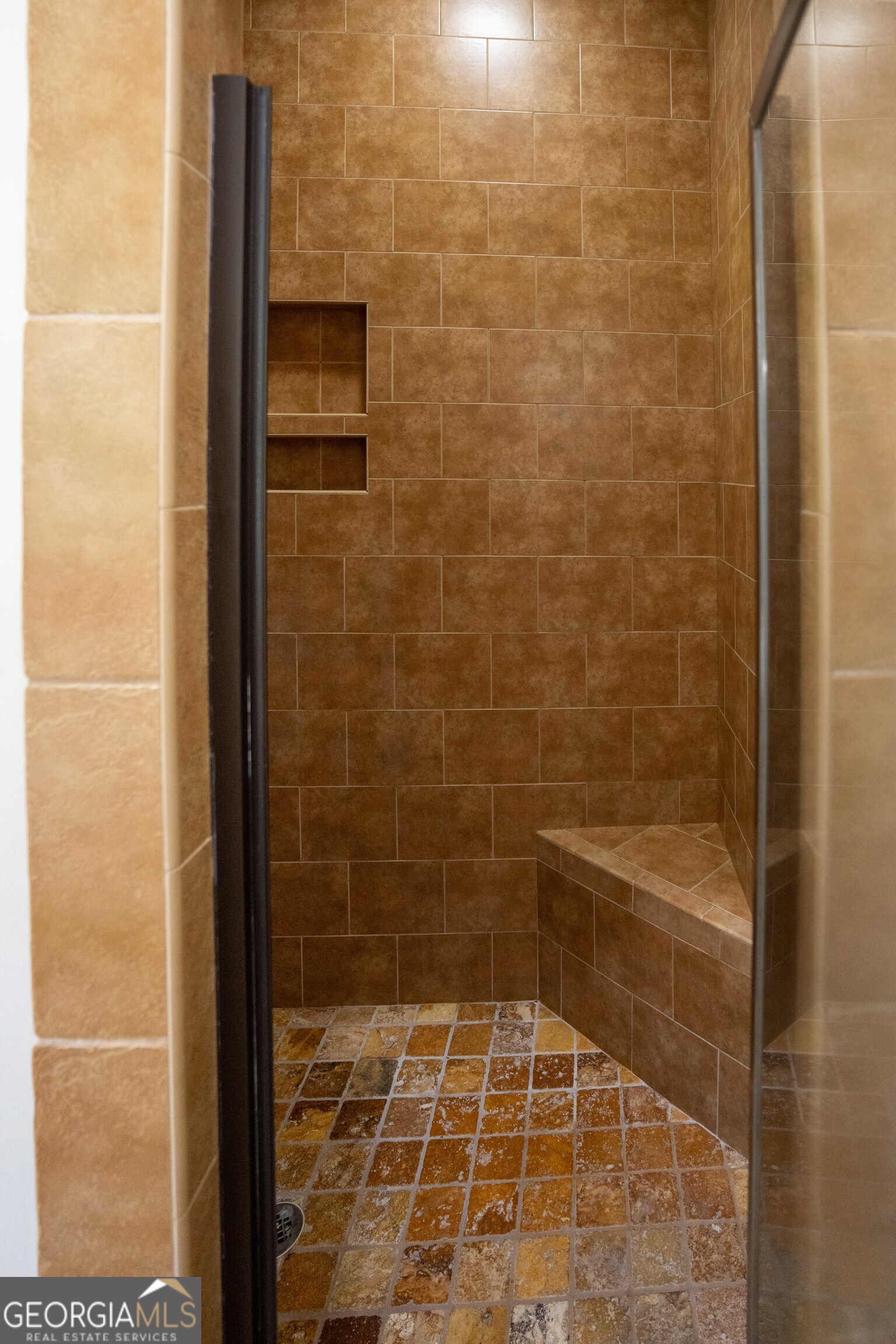 1011 Ridge Terrace Greensboro, GA 30642 - Photo 38 of 72 a bathroom with a glass door shower