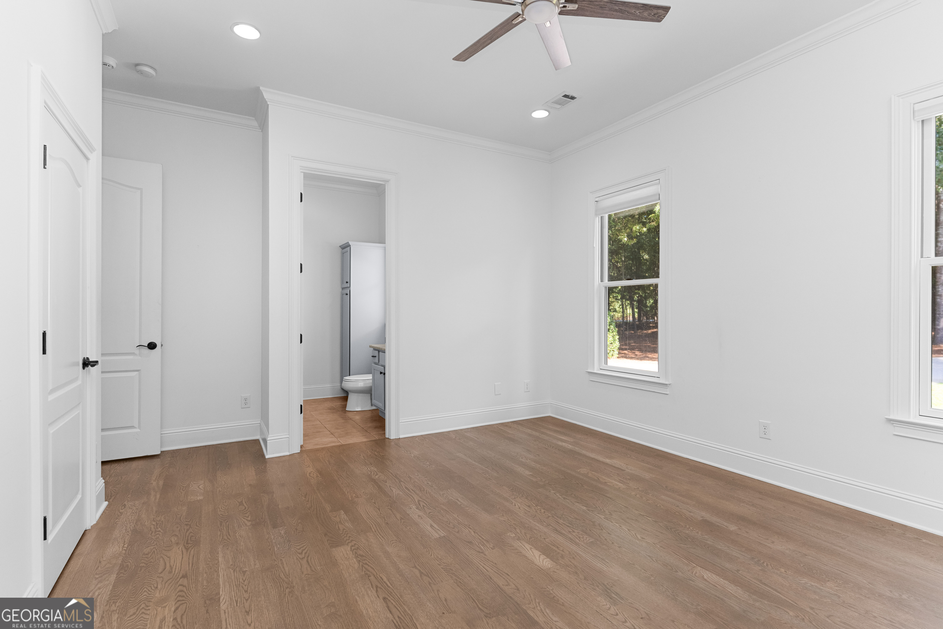 1011 Ridge Terrace Greensboro, GA 30642 - Photo 42 of 72 wooden floor in an empty room with a window