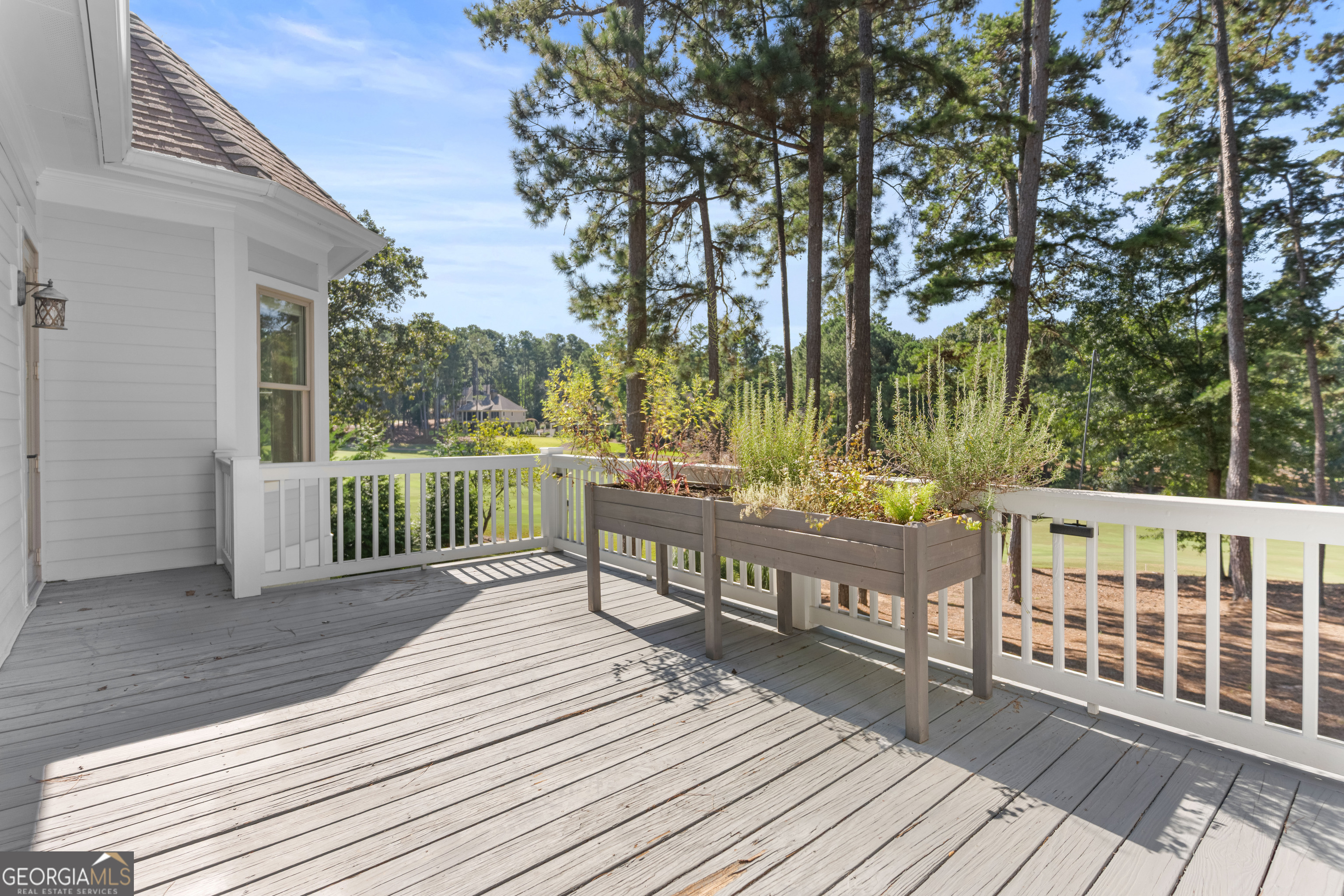 1011 Ridge Terrace Greensboro, GA 30642 - Photo 46 of 72 a view of deck with wooden floor and fence next to a yard